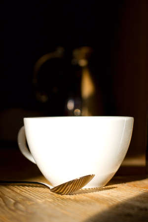 Restaurant Scene with Coffee Tea cup and spoon in the frontの写真素材