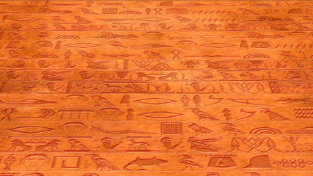 Vertical Egyptian Hieroglyphs Ancient Stone Wall Illustrationの写真素材