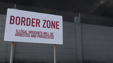 Massive Fence and Border Zone Sign under Clouds Warning Illegal Immigrantsの写真素材