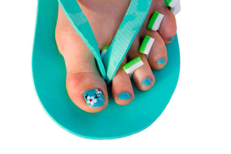 Nails after pedicure - colorful job with flowers. Isolated on white,の写真素材