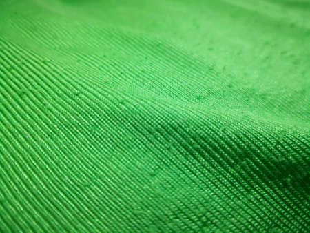 Close up green textile blanket for use as backgroundの素材