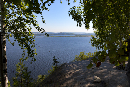 the volga river through the green foliageの写真素材