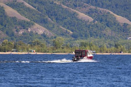 the boat rushes on the riverの写真素材