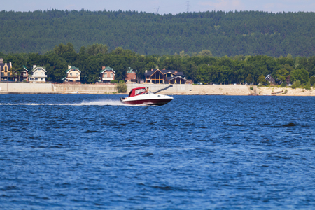 the boat rushes on the riverの写真素材