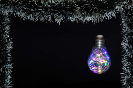 Bulb with LED lights in the Christmas edition. Minimal composition.の写真素材