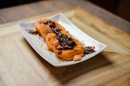 Softy fritters with chocolate cream and nuts