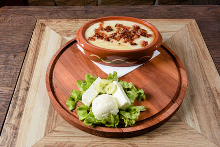 an earthen vessel roasted meal with melted cheeseの写真素材