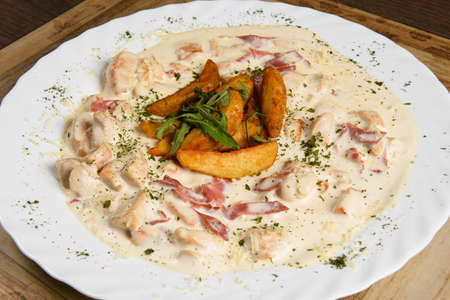 chopped chicken and bacon in a succulent soar creamの写真素材