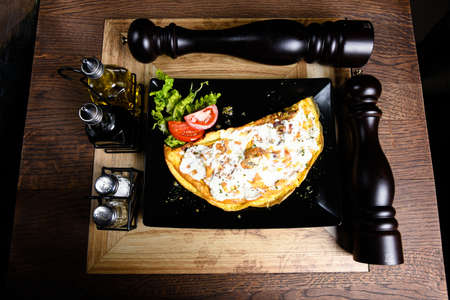 Filled omelet with sour cream