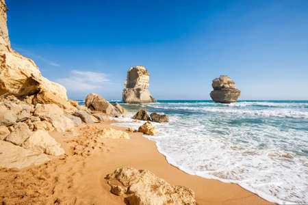 Gog and Magog are two giant limestone stacks offshore from the Gibson Steps on the Great Ocean Road outside Port Campbell in Victoria, Australiaの写真素材