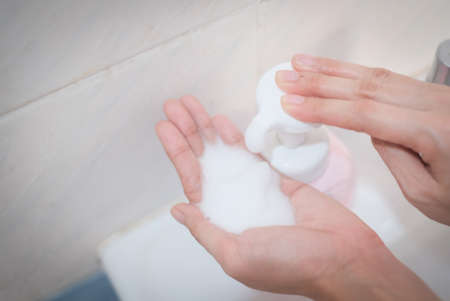 Woman washing hands, Corona virus travel prevention wash hands with soap and hot water. Hand hygiene...