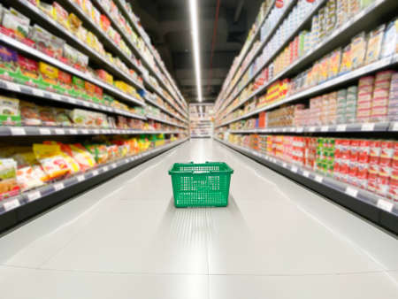 Empty basket at supermarket with blur background, shopping concept.の写真素材