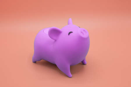 Piggy bank on orange background. Finance, saving money concept.の写真素材