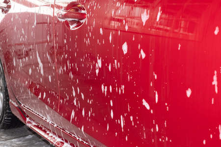 Washing red car, Equipment car wash With red car For cleaning to quality to customer on car showroom of service transport automobile transportation automotive image.の写真素材