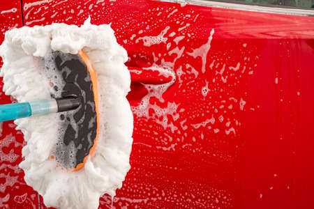 Washing red car, Equipment car wash With red car For cleaning to quality to customer on car showroom of service transport automobile transportation automotive image.の写真素材
