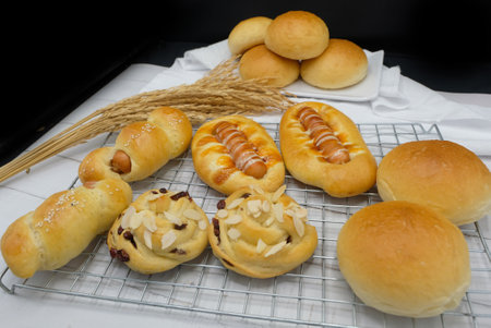 Fresh fragrant bread and bun on the table with copy space. Food concept