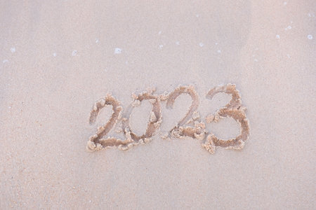 2023 happy New Year coming concept. White waves are lapping towards the shore