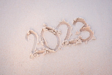 2023 happy New Year coming concept. White waves are lapping towards the shore