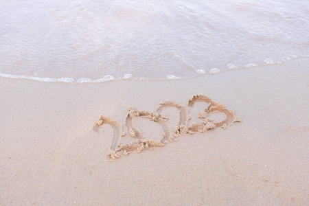 2023 happy New Year coming concept. White waves are lapping towards the shore