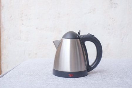 Coffee machine and a cup on the table with white background. Copy space for design. Morning concept.の写真素材