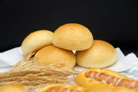 Fresh fragrant bread and bun on the table with copy space. Food concept
