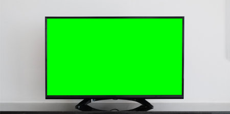 TV with Horizontal Green Screen on the black table with white background.