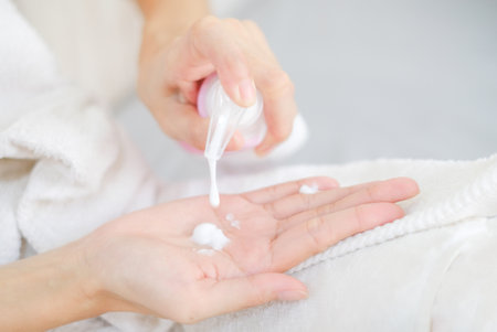Woman applying natural cream, Woman moisturizing her hand with cosmetic cream, Spa and Manicure...