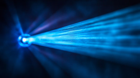 Blue beams laser on black background.の素材