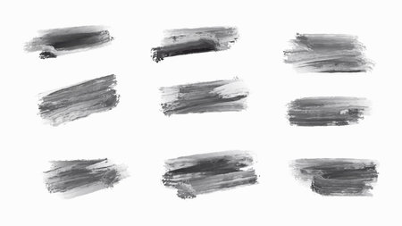 Black Ink Brush Stroke. Isolated on White Background. A bold black brush stroke with rough texture, isolated on a white background.のイラスト素材