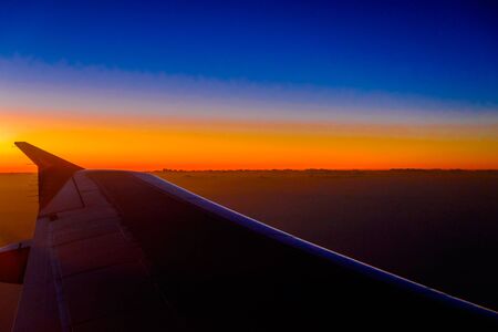 sunset horizon sky on the planeの写真素材