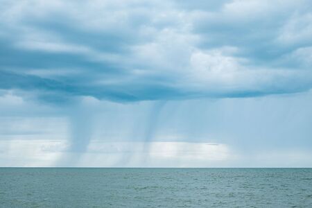 Raining cloud seascapeの写真素材