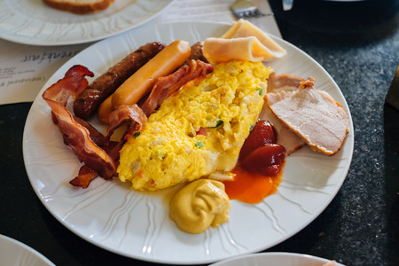American breakfast with omelet bacon and sausageの写真素材
