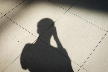 Shadow of photographer on the floorの写真素材