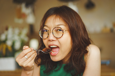Women eating chocolate cakeの写真素材