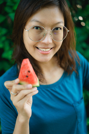 Asian Women Holding Slice Of Watermelon.の写真素材