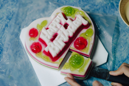 Happy Birthday coconut jelly fancy cake on the blue table.の写真素材