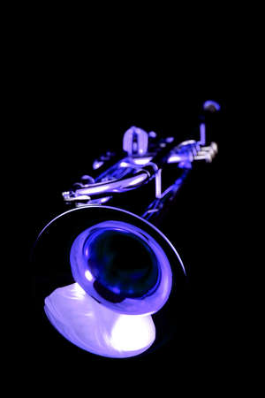 Gold lacquer trumpet with mouthpiece on blackの写真素材
