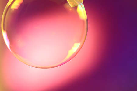 Colorful shampoo bubbles on a pink の写真素材