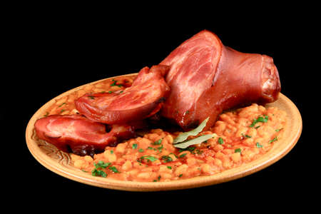 Close up of a steak and beans around in a plateの写真素材