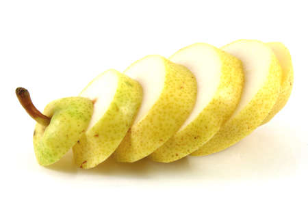 Single pear isolated on white with a bit of shadow cut in sectionsの写真素材