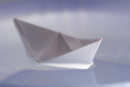 Boat made of paper floating on the water
