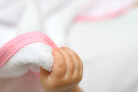 New born baby hand on white 