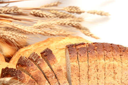 Bread, loaf, cake, baton, crescent on white  with cereals