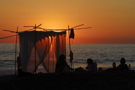 people look sunset at  beach の写真素材