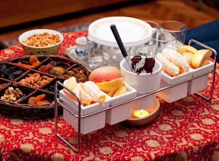 Chocolate fondue with fruit の写真素材