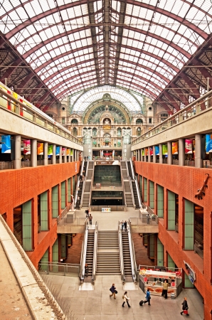 Famous old clock on the facade of the old beautiful railway station in Antwerpのeditorial素材