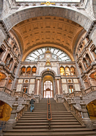 Famous old clock on the facade of the beautiful old railway station in Antwerp. Belgiumのeditorial素材