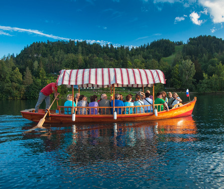 Traditional wooden boats on picture perfect lake Bled, Slovenia on 18 September, 2015のeditorial素材