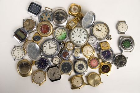 Old mechanical and electronic watch on a light background.の写真素材