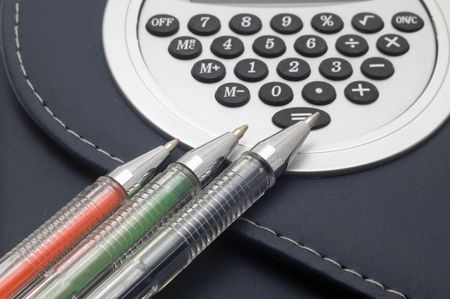 Coloured pens on notebook background.の写真素材